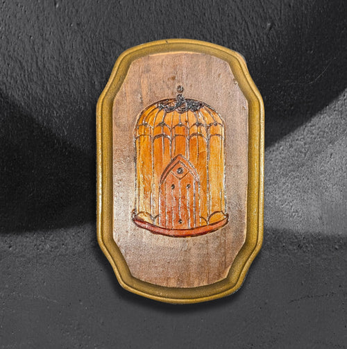 Birdcage neotrad flash block by CamiThunderInk, a small reclaimed pine block with a burned and painted domed Victorian birdcage with an eye on the door, in amber tones with gold edging