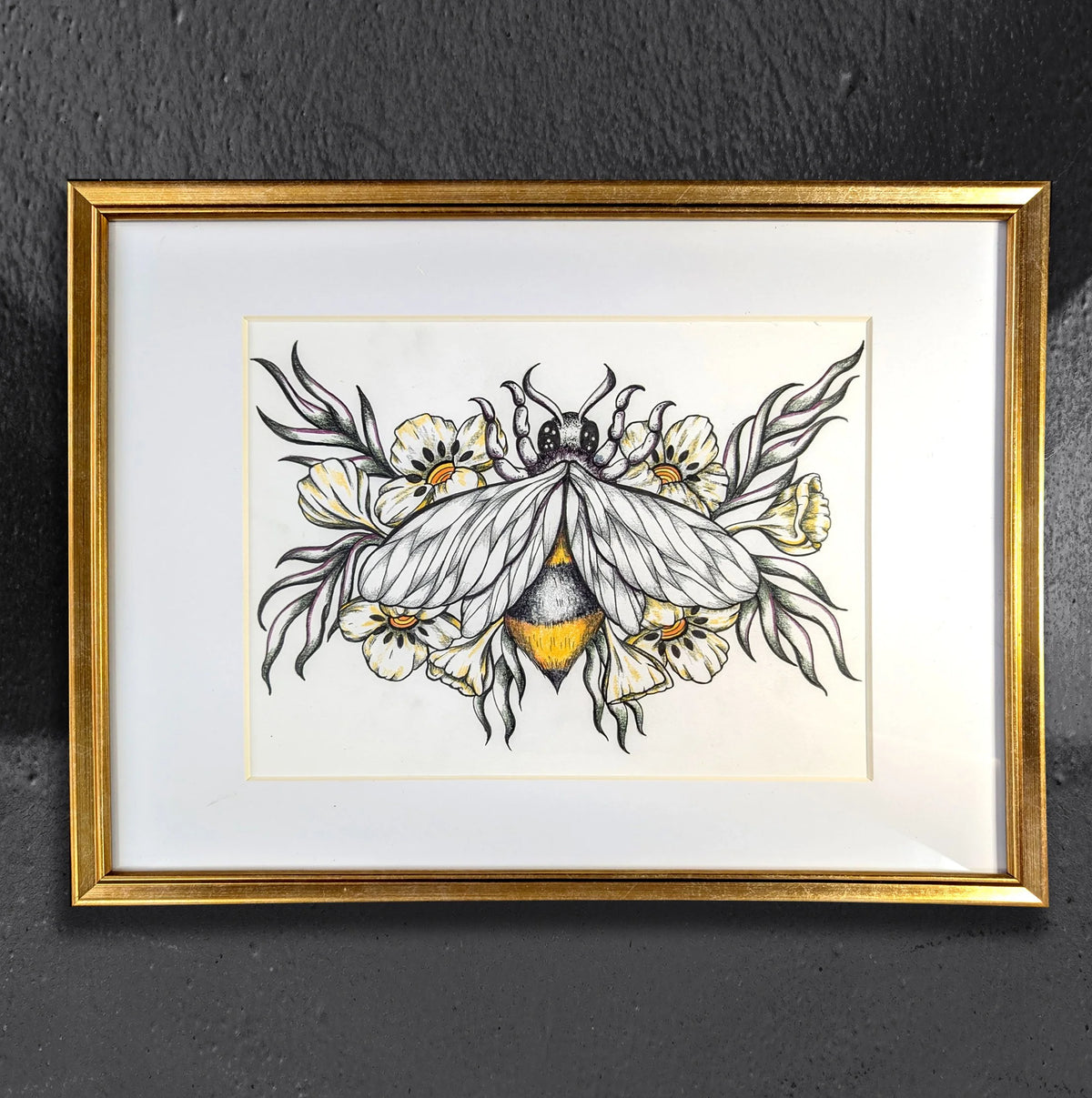 Honey Toned Floral Bee by CamiThunderInk, an original colored pencil and ink drawing of a honey bee surrounded by flowers, matted in a gold frame