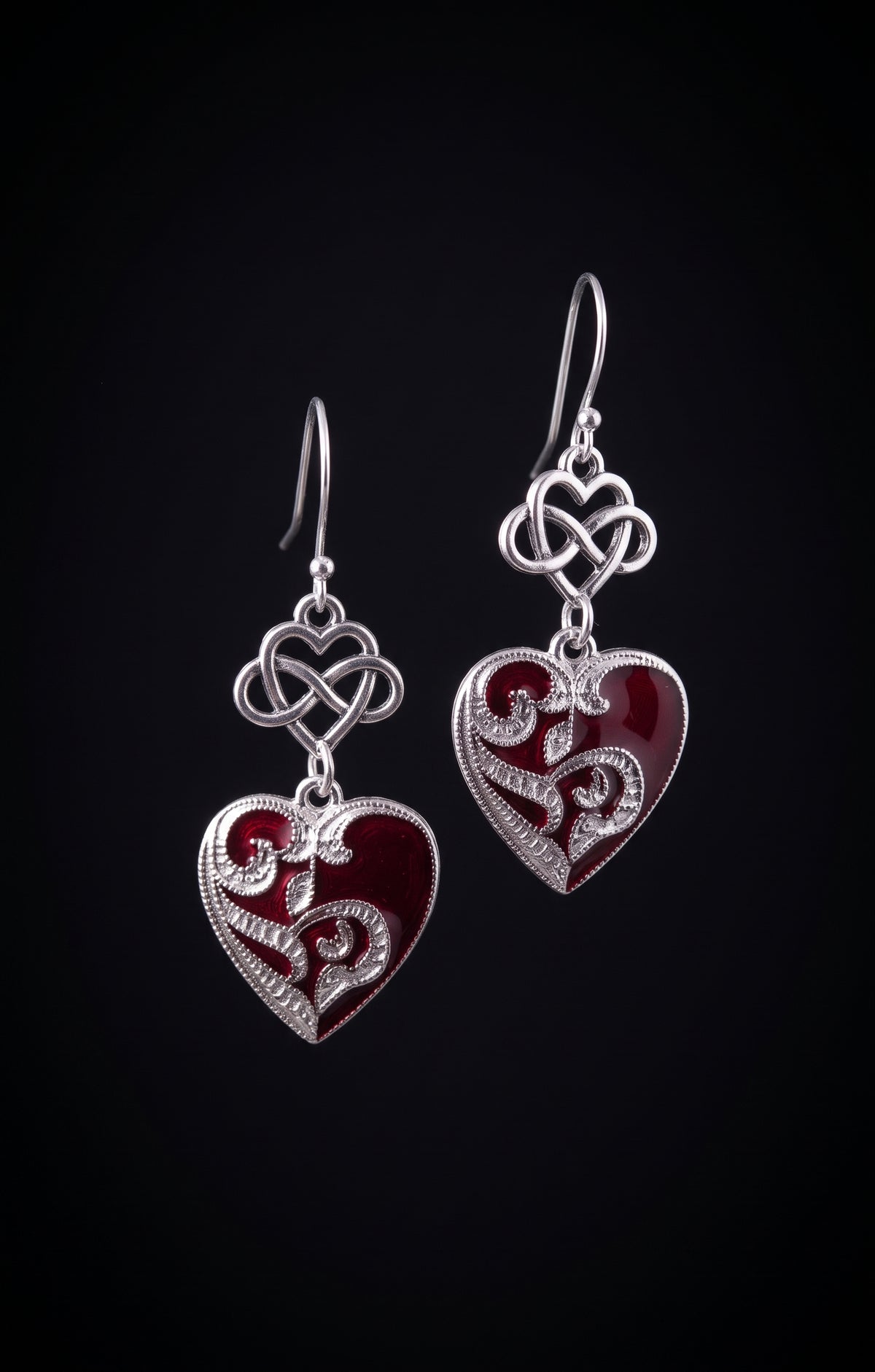 nfinity Hearts Earrings by Circle of Heather, silver-tone dangle earrings with an infinity heart knot above a filigree heart in deep red enamel