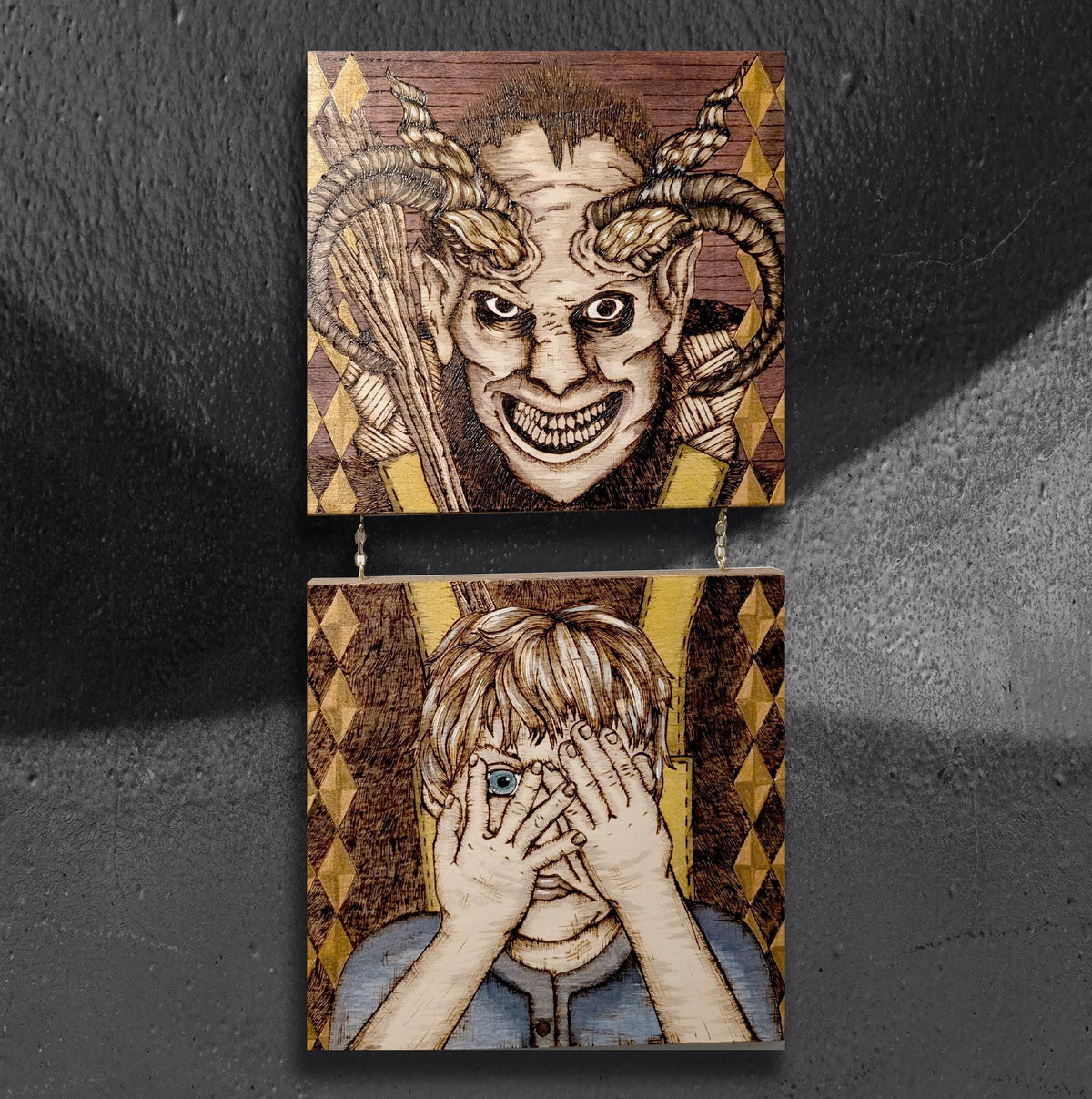 Perilous Penance by CamiThunderInk, an original two panel pyrography and wood stain artwork of a horned Krampus, with the panels joined by a gold chain