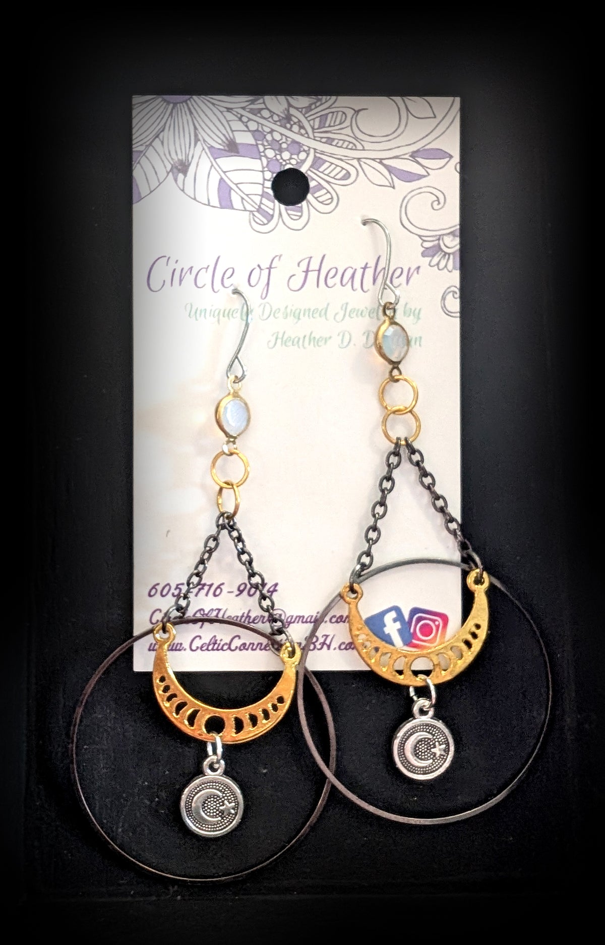 Chandelier Moonphase Earrings by Circle of Heather, both earrings shown on the branded Circle of Heather card with opalescent stones, gold rings, oxidized hoops and gold moon phase crescents.