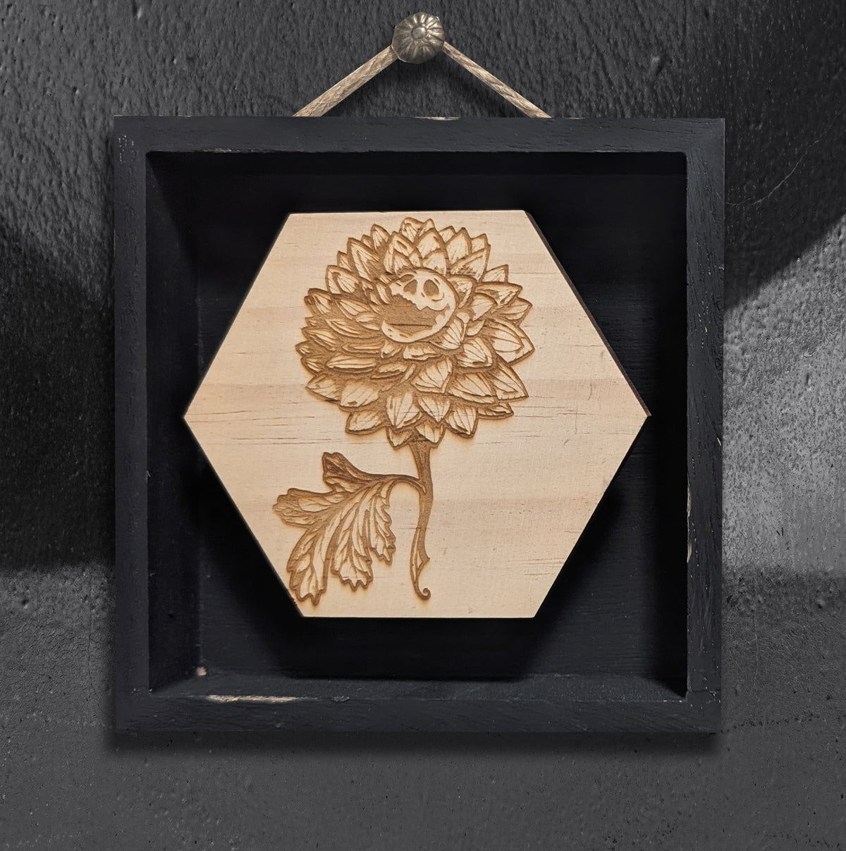 Skully Flowers Dahlia miniature framed piece by CamiThunderInk, a laser etched wood dahlia with a skull at its center, in a small 4x4 frame