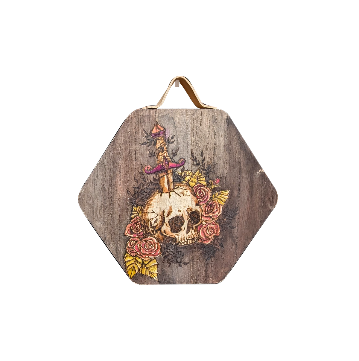 Another view of Arthur's Rosy Relic by CamiThunderInk, an original pyrography and watercolor piece on solid wood showing a skull pierced by a dagger and surrounded by bright pink roses