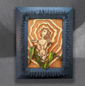 Birth of a Calla Lily by CamiThunderInk, an original layered relief artwork of a woman burned and watercolored on laser cut birch, surrounded by gold rays and mounted on a recycled cabinet door with a black border