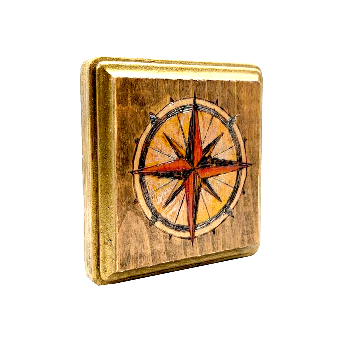 Another view of Compass flash block by CamiThunderInk, a small reclaimed pine block with a burned and painted compass rose in amber and red, with gold edging