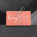 Pink passive aggressive parking cards by Reclamation Tattoo and Oddities, a 25 pack of business cards reading Hey! You parked like a total asshole. Stop doing that., tied with a silver bow